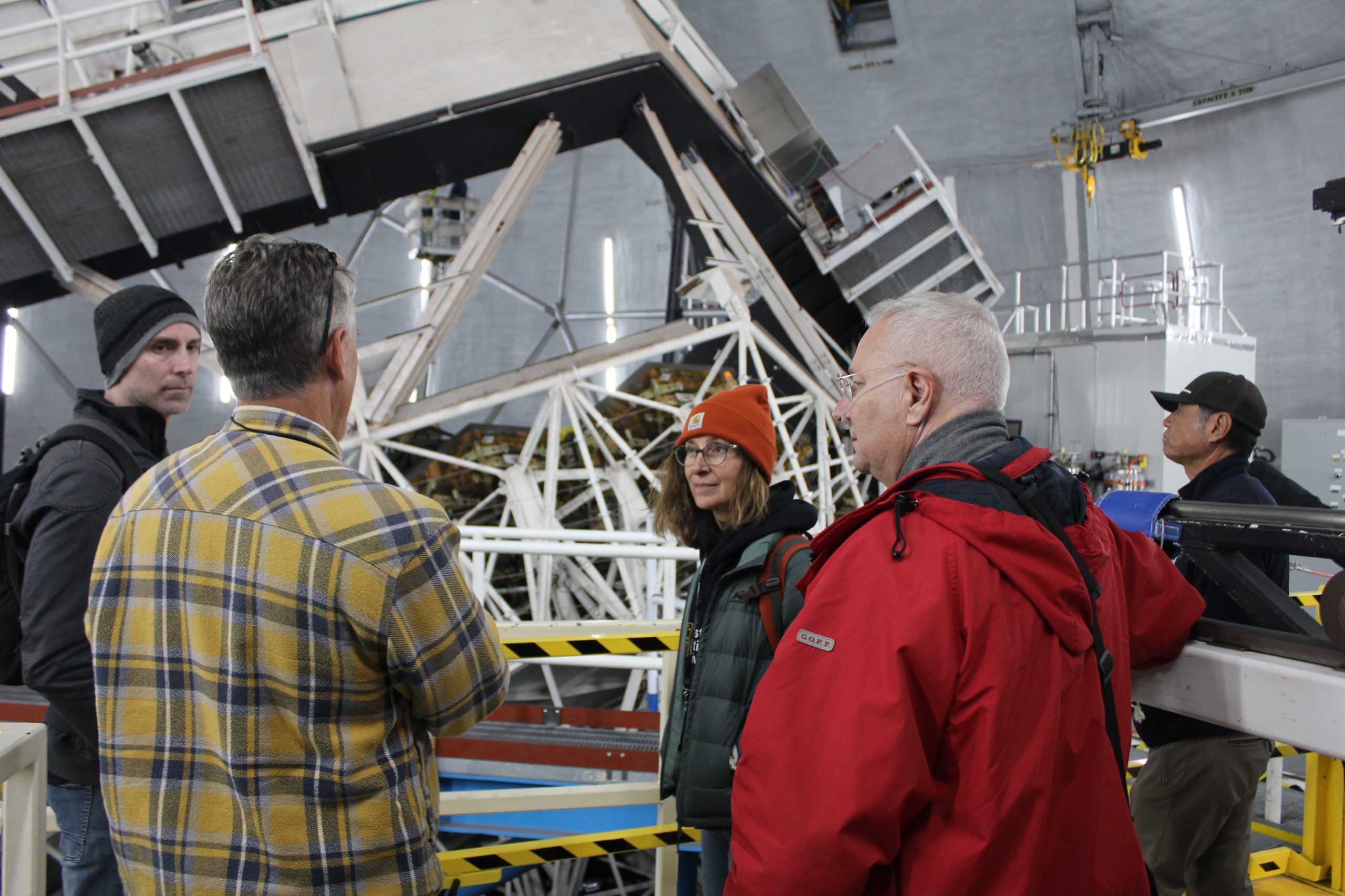 Scientists discussing in an observatory
